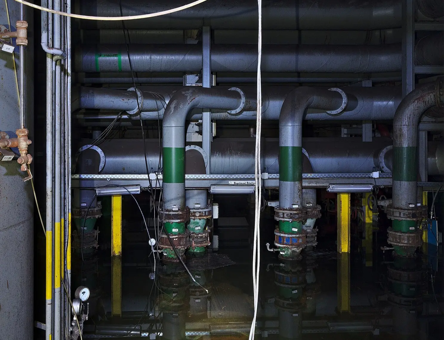 Metal water pipes along a building wall